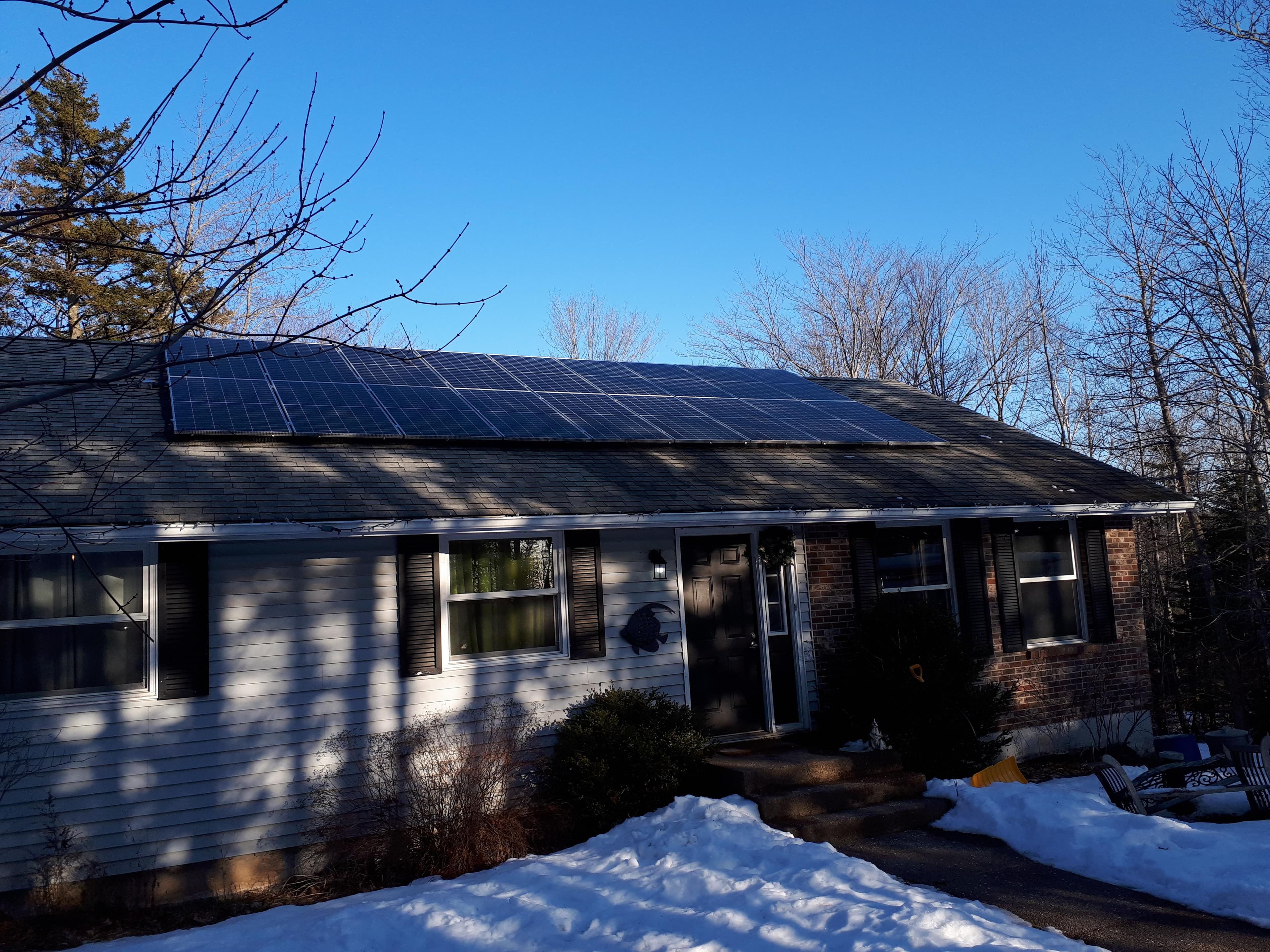 Solar X crew completing a rooftop solar installation on an Ontario home