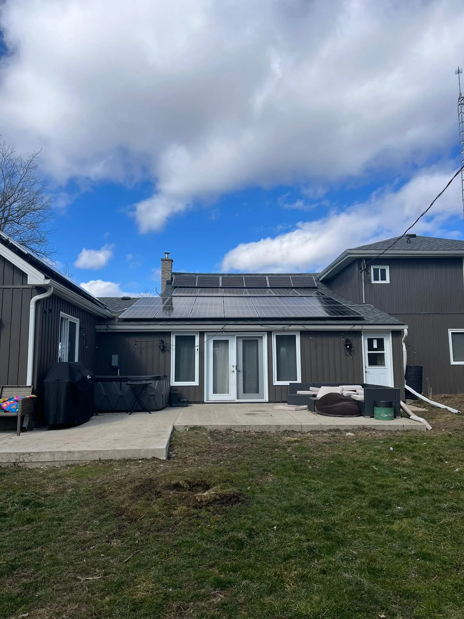 Residential solar panels generating electricity during daytime on modern home roof