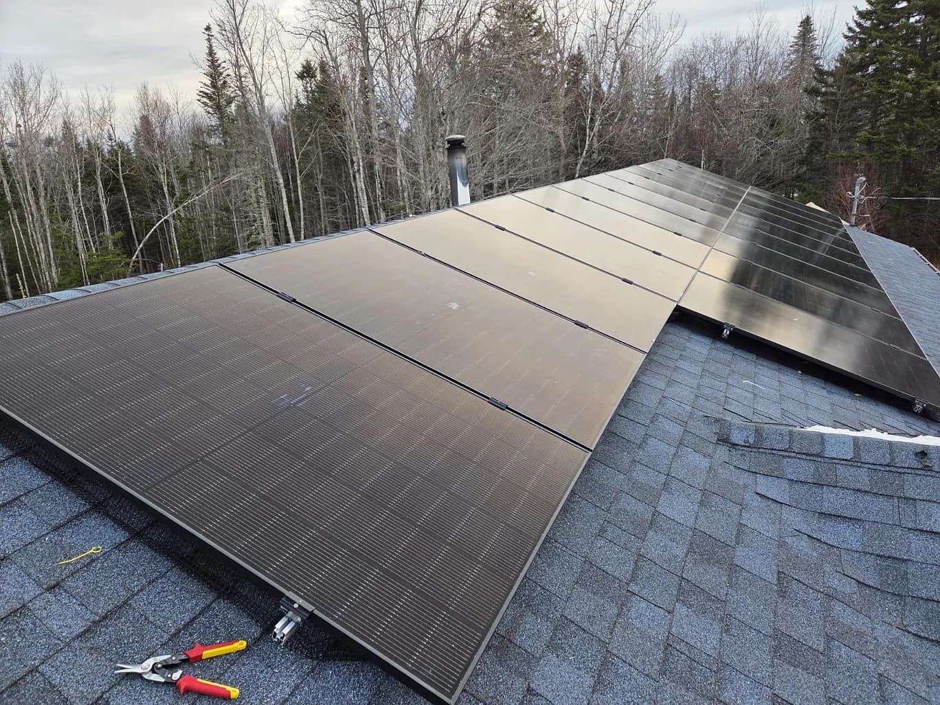 Residential solar panel installation in Ottawa connected to Hydro Ottawa grid with bi-directional meter